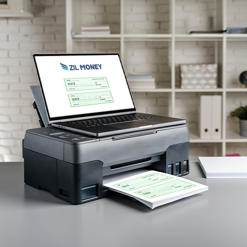 A Laptop Is Sitting Up to a Printer. the Printer Printing Checks Using the Free Check Print Method