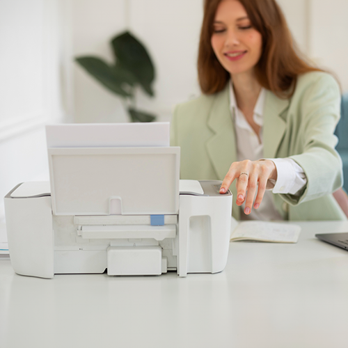 A Woman Is Using a Printer to Create Instant Checks.