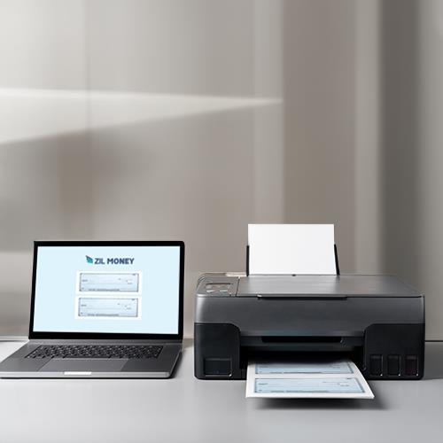 A Printer and a Laptop on a Desk, Showcasing the Process of Using Checks Online To Order.