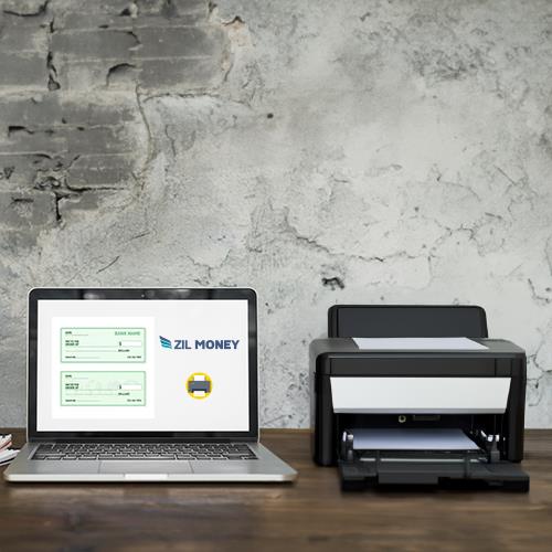 A Laptop Is Sitting on a Table Next to a Printer, Showcasing Free Check Printing Online