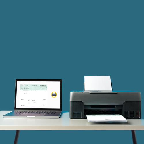 A Printer and a Laptop on a Desk, Showcasing the Setup for Placing Checks Order Online
