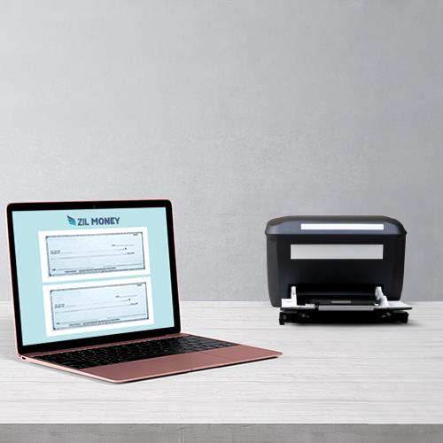 A Modern Workspace with a Laptop Open to Free Check Printing Software Online on Its Screen, Positioned Next to a Printer Prepared for Printing Checks.