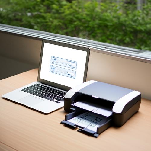 A Home Office Setup Optimized for Efficiency, It Features a Laptop Connected to a Printer for Easy Print Checks Online and Document Management.