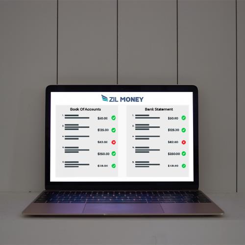 Laptop Screen Displaying the Process of Reconciling Bank Accounts.