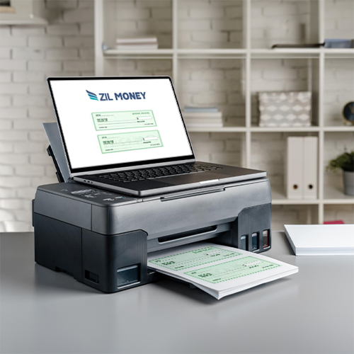 In a Modern Office Setting, a Laptop Is Placed on Top of a Multifunction Printer, Which Displays a Check Interface. The Printer Prints Check Papers.
