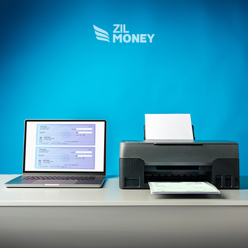 A Laptop and Printer on a Desk and Laptop Displays Bank Checks For Printing