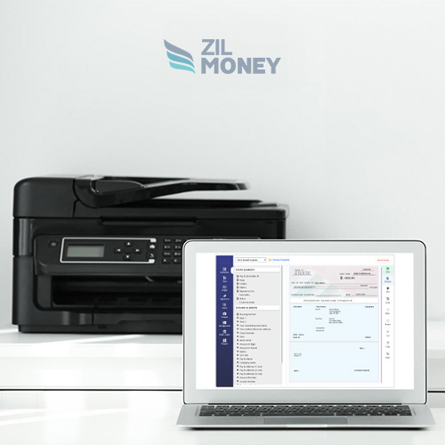 A Laptop Displaying a Check Printing Software Interface Next to a Print Checks Online Free