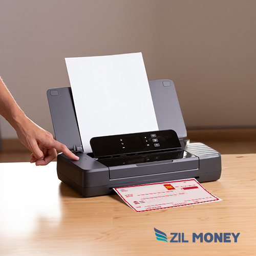 An Individual Using a Printer. at Home, He Is Printing Wells Fargo Checks