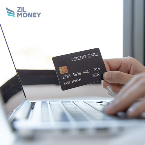A Hand Holding a Credit Card, Boost Business Benefits of Processing Credit Card Payments Online