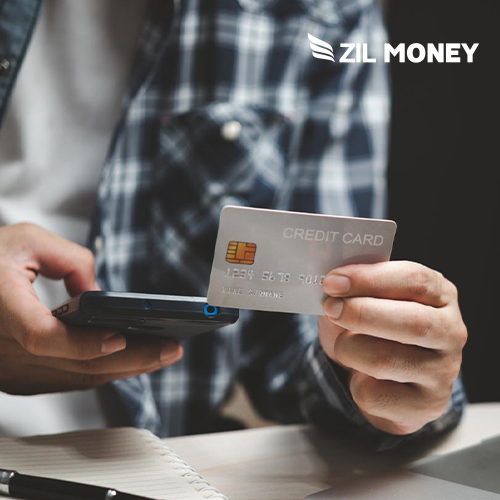 A Man Holding a Credit Card And A Smartphone, Maximize Convenience Best Ways to Send Money with Credit Card