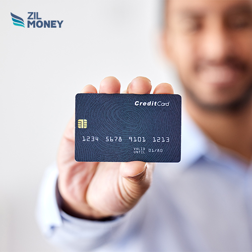 A Man Holding a Credit Card, Optimize Your Workflow How to Process Credit Card Payments Efficiently