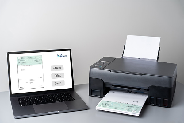 A Laptop Displaying the Check Printing Software Download Free For Financial Process Next to a Printer with a Printed Checks For Payments