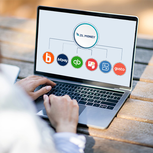 A Man Woring On a Laptop Showing Accounting Software Integration With Zil Money, Financial Processes with Accounting Software Integration