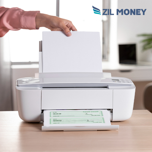 An Individual Using a Printer. At home, He Is Finding How To Print Checks At Home, Efficiently and Conveniently