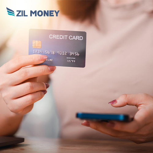 A Person Holding a Smartphone and A Credit Card, Payment By Credit Card Online Efficiently for Advanced Financial Circulation