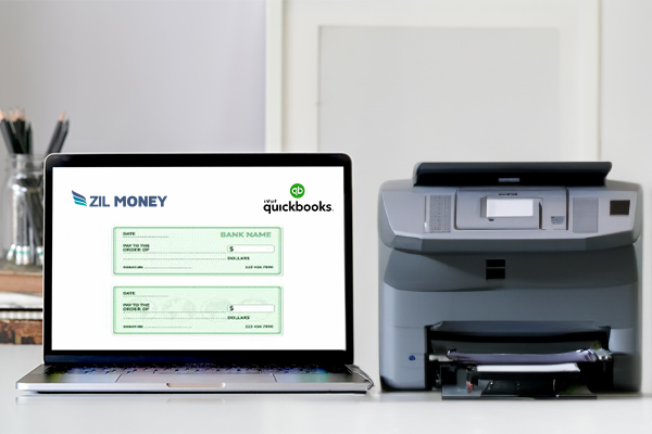 A Laptop and A Printer Print QuickBooks Checks