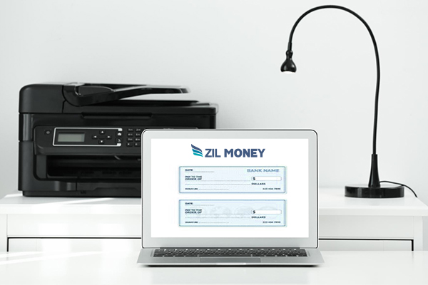 A Laptop Showing Checks And A Printer Behind