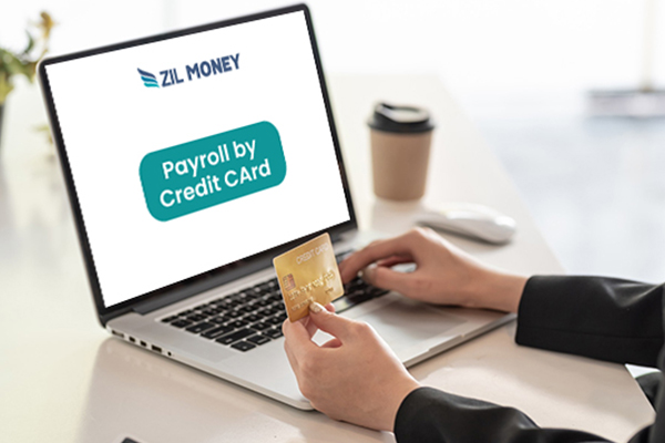 A Person Working On A Laptop Paying Payroll BY Credit Card, Pay Your Deel Payroll by Credit Card Effectively