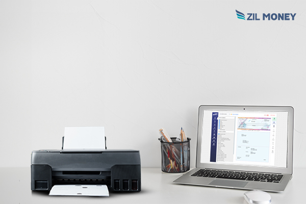 A Laptop and A Printer Print Check. Symbolizing Vistaprint Business Checks Alternative - Customize and Print Easily