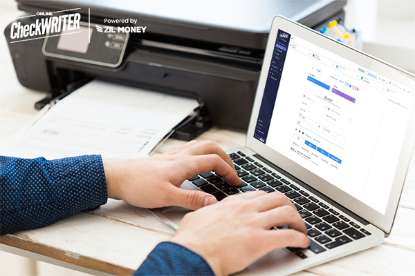 A Person Creating Checks Using Laptop And A Regular Printer. Still, Buy Checks Online When Wildfire Burns the U.S.