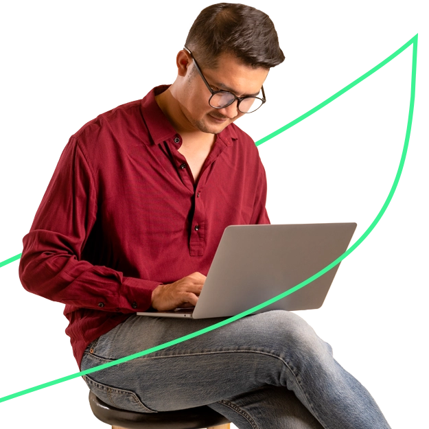 A Man Using a Laptop to Make a Payment. Three Checks Per Page | Print Checks Efficiently