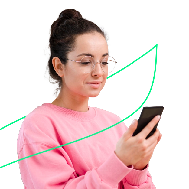 <br />
Effortless Payroll Check Creation: A smiling man with a beard and light brown hair, wearing glasses and a denim shirt, is looking down at a smartphone he holds in both hands, appearing to type or interact with it. The background is plain white with no other elements.