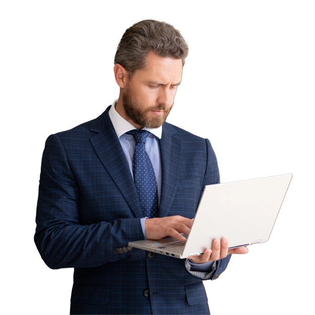 <br />
Simplify Payments, Ditch the Manual Work: A serious-looking man in a blue plaid suit and tie stands and looks down at a silver laptop he is holding, appearing to be focused on his work.