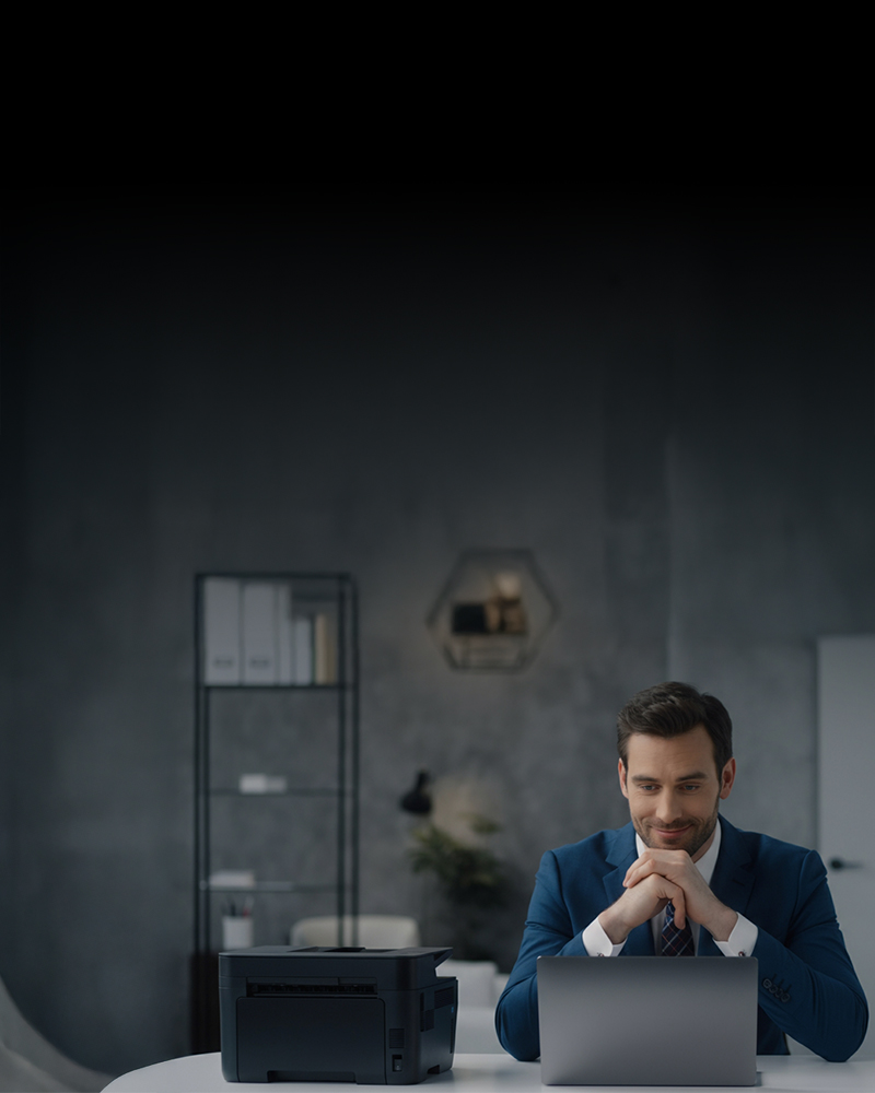 A Man Using A Laptop to Make a Payment Easily, QuickBooks Check Printing Choose Design Enter Information