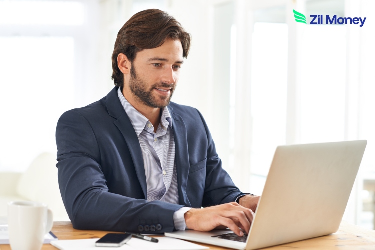 A Businessman Uses a Laptop, Showing How Accounting Software Integration Keeps Financial Records Accurate and Clear.