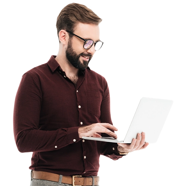  A man in a maroon shirt using a laptop to work, demonstrating the convenience of being able to print checks from any account.