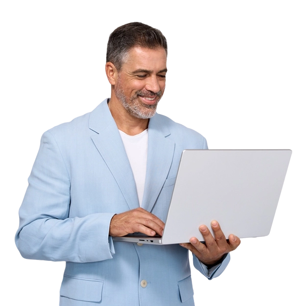 A smiling businessman uses a laptop, showing how to Simplify Invoicing with modern technology.
