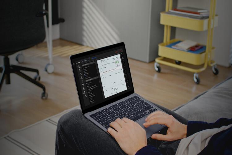 A Man Uses a Laptop, and the Laptop Screen Displays an Invoice List From the Platform. Represents Invoice Management, Streamline Billing and Get Paid Faster