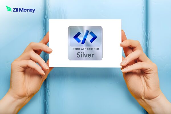 A Hand Showing Zil Money Joins QuickBooks Silver Tier Partnership