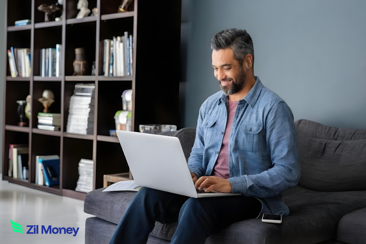 Pay Vendors on Time: The Power of Automated Bill Creation A Man Using A Laptop to Make a Payment Easily. Email To Bill Automation Turns Invoice Emails into Ready-To-Pay Bills