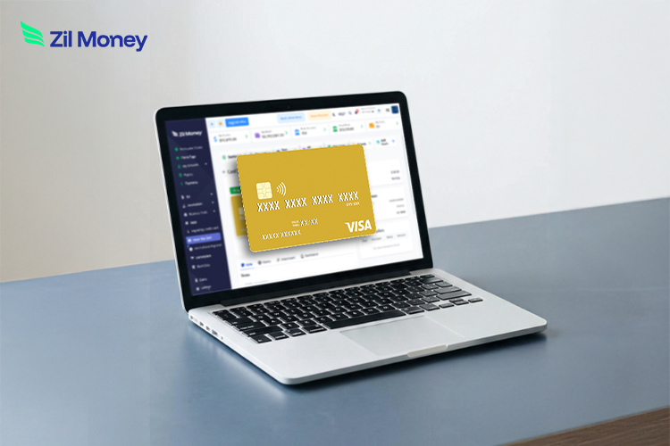 Laptop screen showing a Zil Money dashboard with a gold Visa instant virtual card displayed digitally.