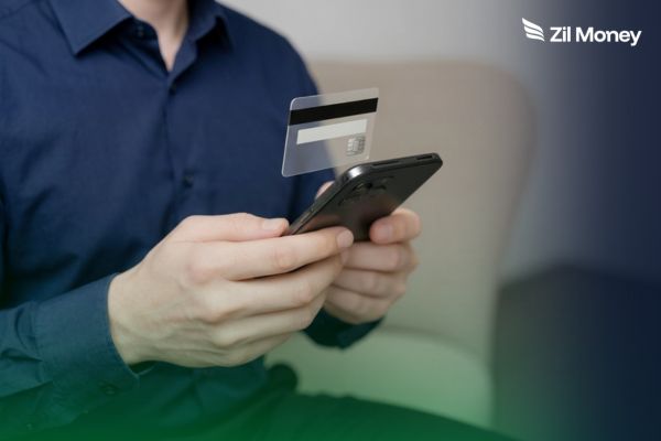 Virtual Cards for Hospital Supplier Spending Limits A person holding a smartphone with a floating card, showing Virtual cards with supplier-specific spending limits.