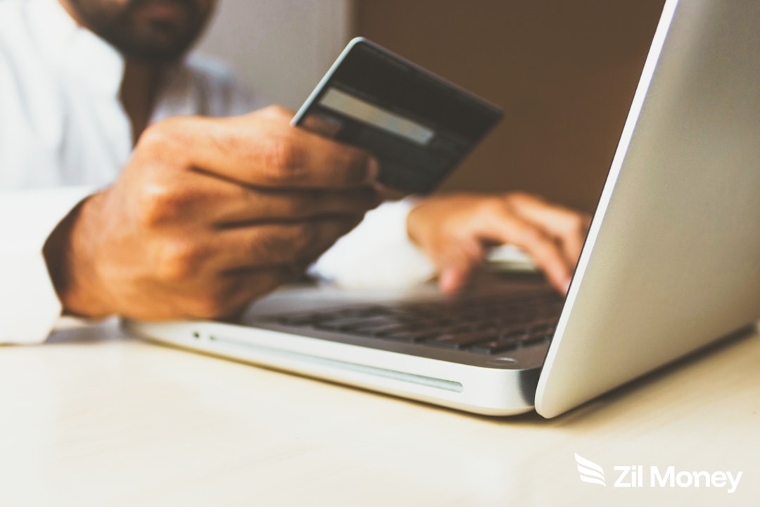 pay-quickbooks-payroll-credit-card-zm-v3 Business owner paying QuickBooks payroll with a credit card using the Zil Money dashboard