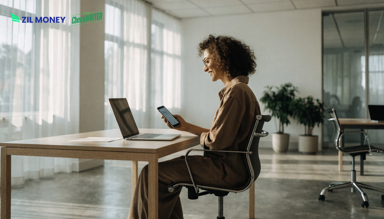 Business owner using the best way to receive payment online on a laptop and phone Business owner using the best way to receive payment online on a laptop and phone