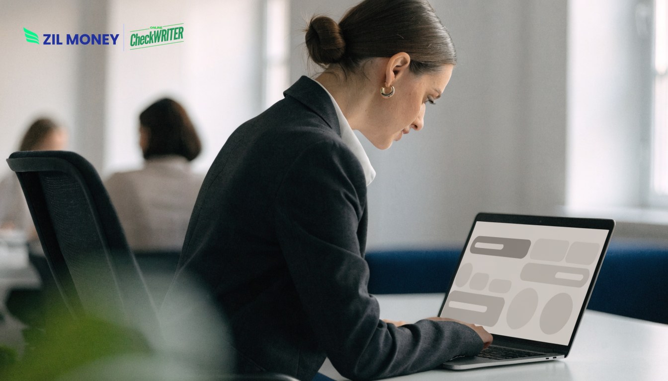 Finance manager using online payroll management for business on a laptop dashboard
