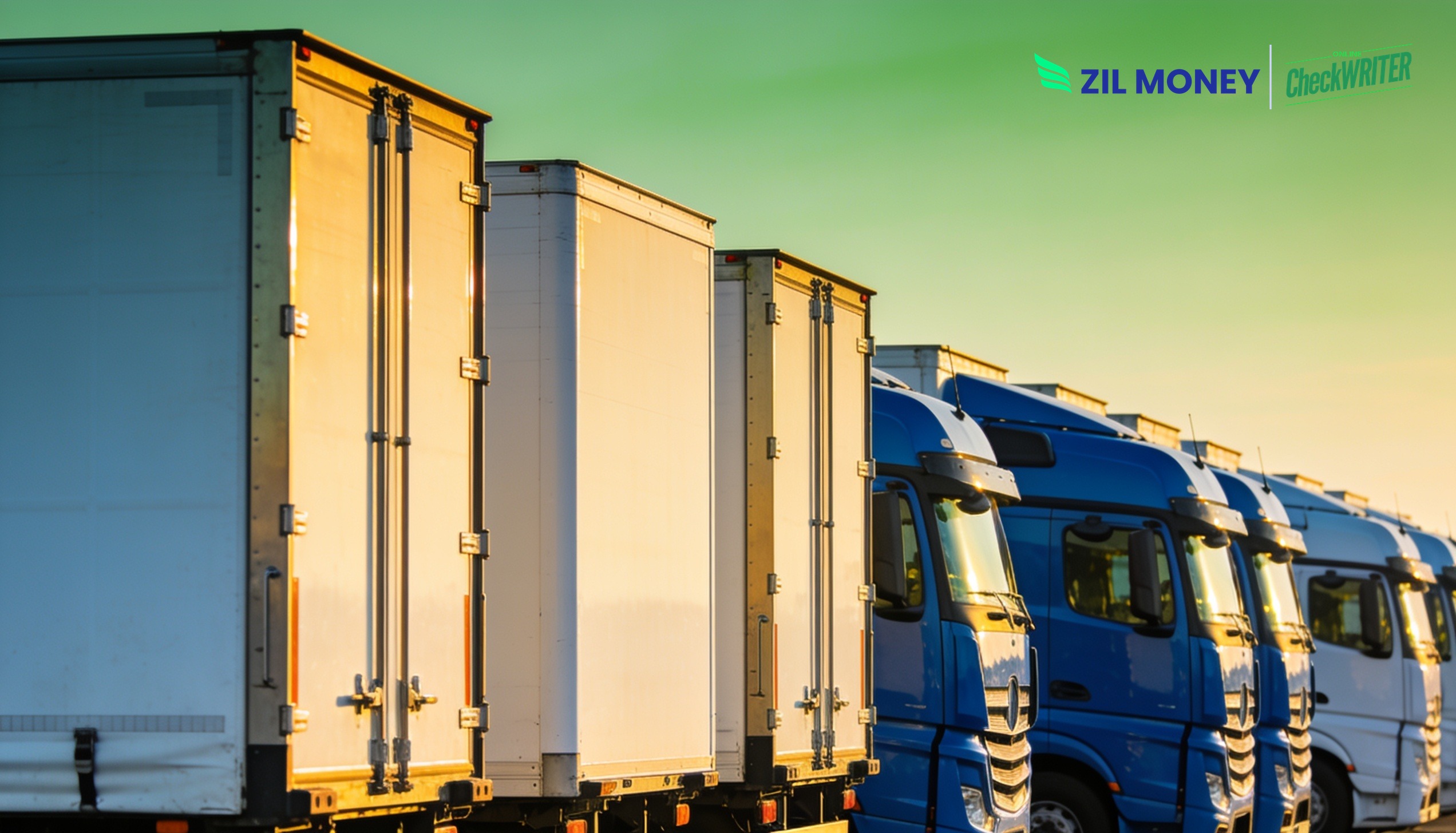 payment-processing-for-freight-carriers-zm-color Row of freight trucks at a logistics yard representing payment processing for freight carriers