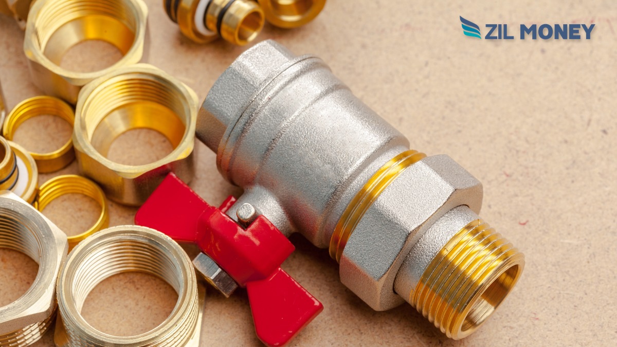 Buy Now Pay Later for Plumbing Companies – Zil Money Plumbing fittings and valve on a counter with the Zil Money logo, representing credit card vendor payments for plumbing companies