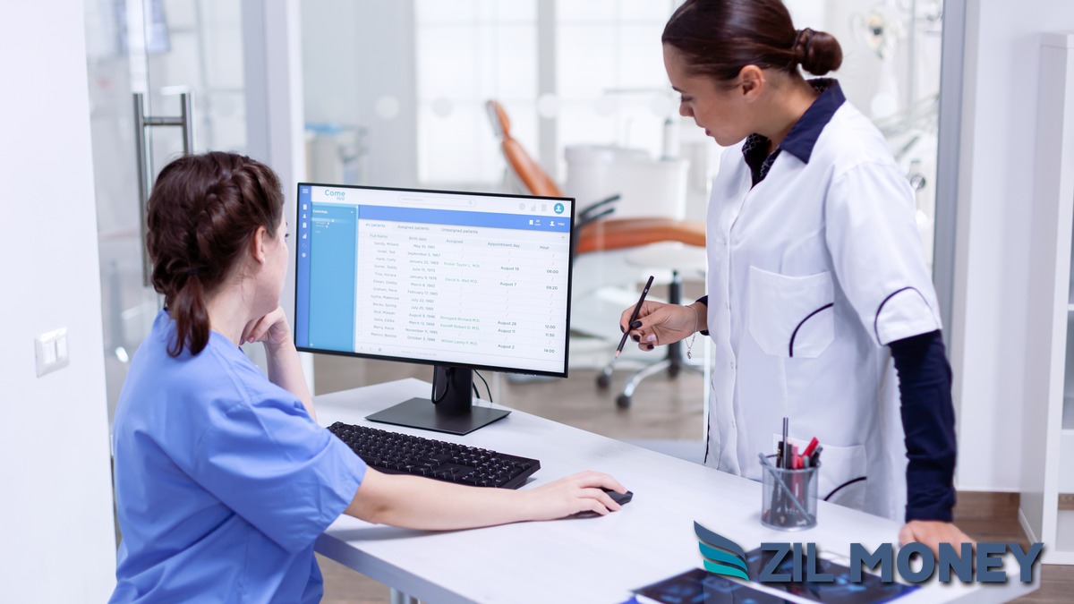 Tennessee dental office billing team reviewing patient records at the front desk, representing credit card and ACH vendor payments for medical and dental practices